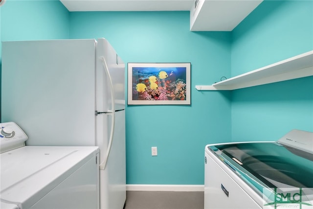 laundry area featuring washing machine and dryer