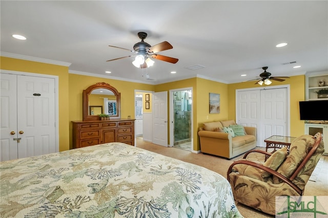 bedroom with ensuite bathroom, light colored carpet, ceiling fan, and crown molding