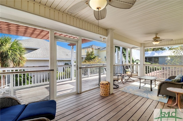 sunroom / solarium with ceiling fan