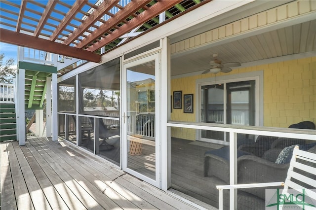 wooden deck with a sunroom, a pergola, and ceiling fan