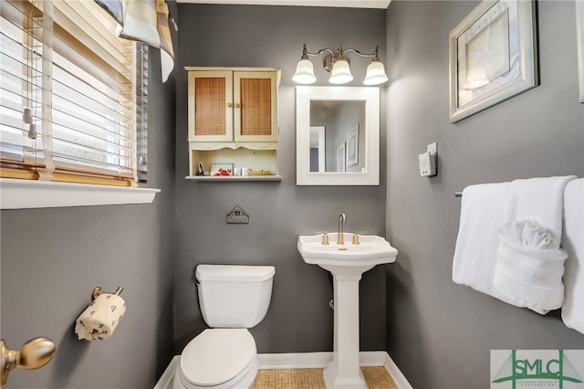 bathroom featuring tile patterned floors and toilet