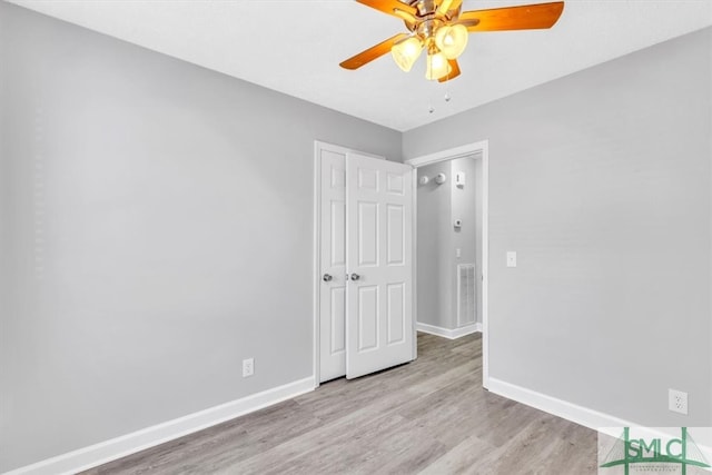 unfurnished bedroom featuring ceiling fan and light hardwood / wood-style flooring