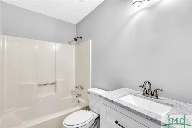 full bathroom with shower / tub combination, vanity, a textured ceiling, and toilet