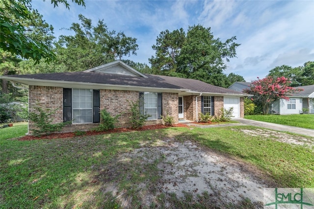 single story home featuring a front lawn and a garage