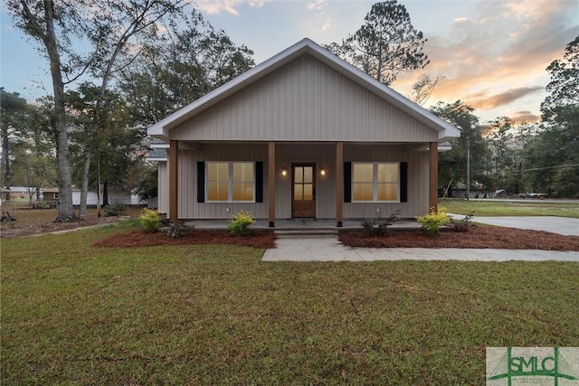 215 Wildwood Dr, Sylvania, GA 30467 - view of front of house featuring a porch and a front yard