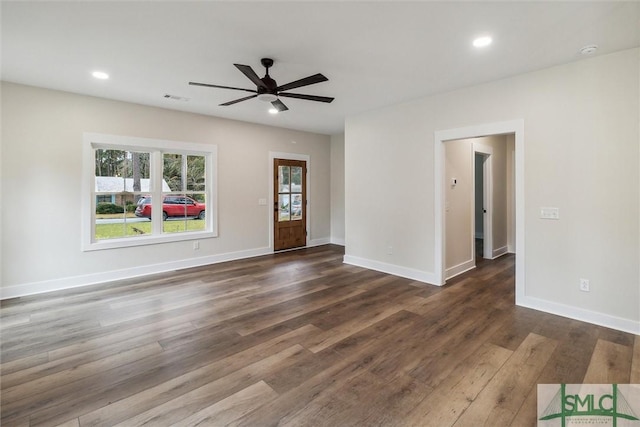 215 Wildwood Dr, Sylvania, GA 30467 - unfurnished living room featuring dark wood-type flooring, a ceiling fan, and recessed lighting