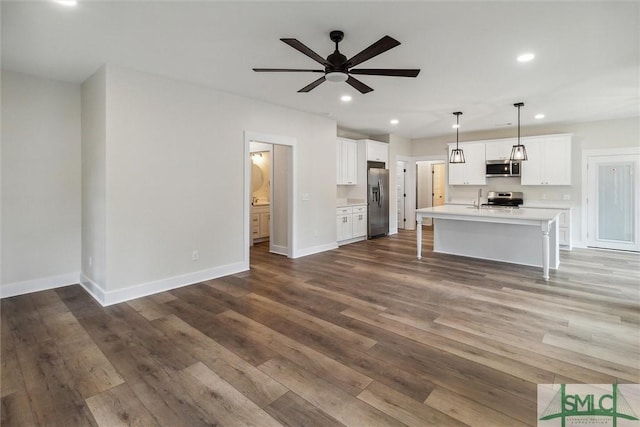 215 Wildwood Dr, Sylvania, GA 30467 - unfurnished living room with dark wood-style flooring, recessed lighting, and ceiling fan
