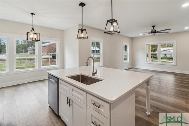 215 Wildwood Dr, Sylvania, GA 30467 - kitchen with dishwasher, healthy amount of natural light, open floor plan, light wood-style flooring, and recessed lighting