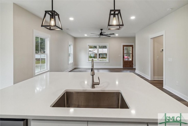 215 Wildwood Dr, Sylvania, GA 30467 - kitchen featuring open floor plan, light countertops, ceiling fan, decorative light fixtures, and recessed lighting
