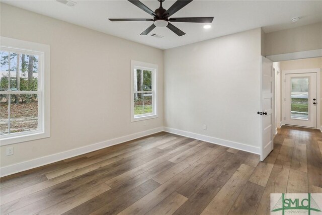 215 Wildwood Dr, Sylvania, GA 30467 - unfurnished room with plenty of natural light, wood-type flooring, ceiling fan, recessed lighting, and a smoke detector