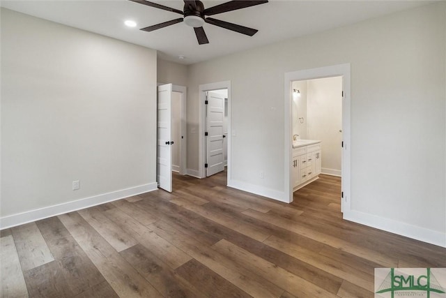 215 Wildwood Dr, Sylvania, GA 30467 - unfurnished bedroom with wood-type flooring, recessed lighting, and ensuite bath
