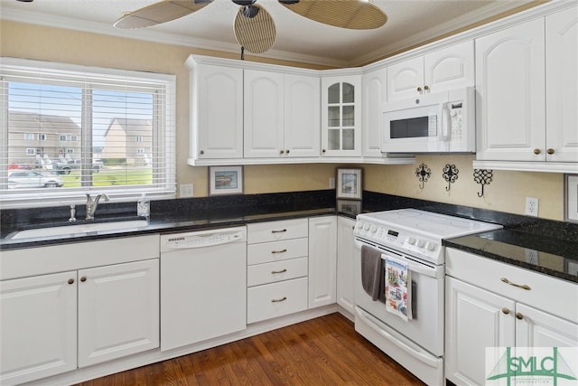 kitchen with crown molding, white cabinetry, sink, dark wood-type flooring, and white appliances