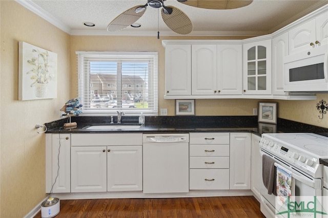 kitchen with white appliances, dark hardwood / wood-style floors, white cabinetry, and sink