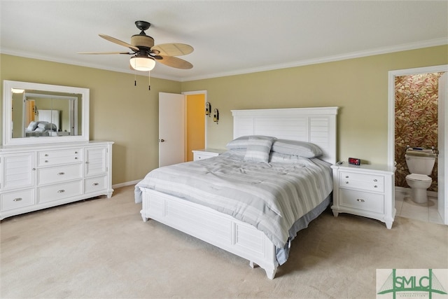 bedroom with ensuite bathroom, ceiling fan, light carpet, and ornamental molding