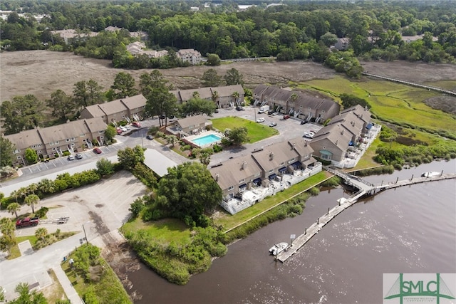 birds eye view of property with a water view