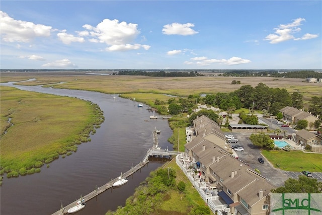 bird's eye view with a water view and a rural view