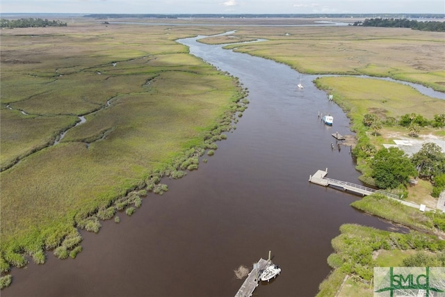 drone / aerial view with a water view and a rural view