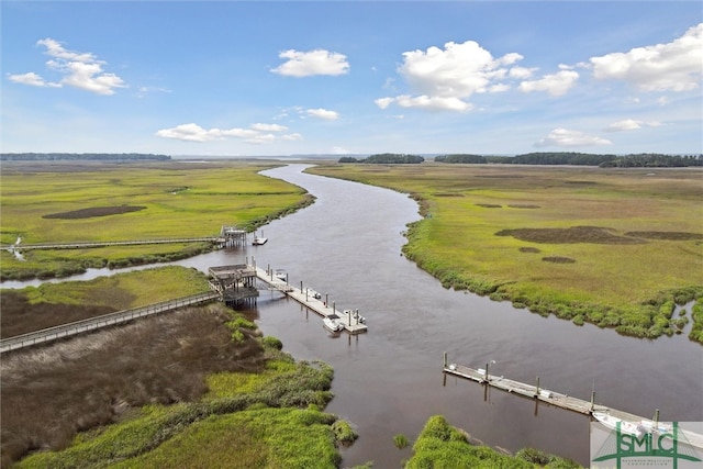 drone / aerial view featuring a water view and a rural view