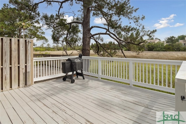 wooden terrace featuring grilling area