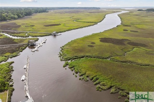 birds eye view of property with a rural view and a water view