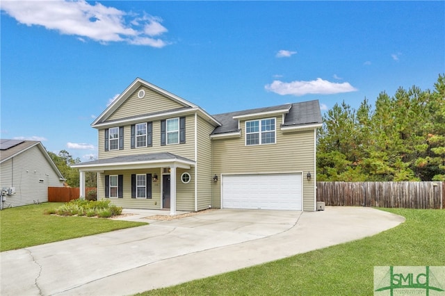 view of front of property with covered porch, a garage, and a front lawn