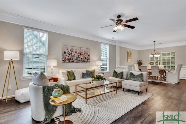 living room with ceiling fan, a wealth of natural light, dark hardwood / wood-style floors, and ornamental molding