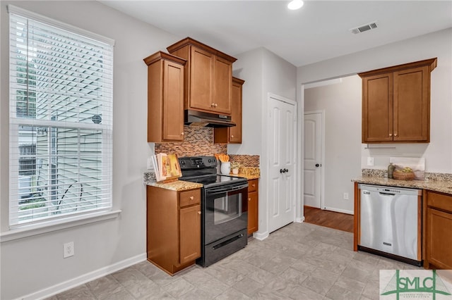 kitchen featuring black electric range, tasteful backsplash, stainless steel dishwasher, and light stone counters