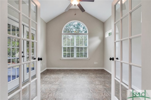 spare room featuring french doors, ceiling fan, and vaulted ceiling