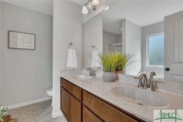 bathroom with tile patterned flooring, vanity, toilet, and a shower with shower door