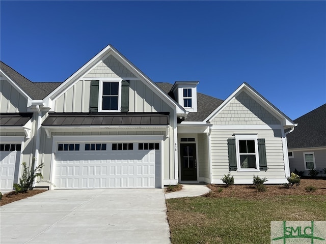 view of front of property with a garage and a front yard