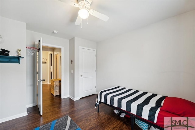 bedroom with ceiling fan and dark hardwood / wood-style floors