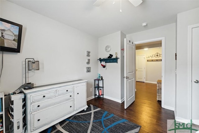 bedroom with ceiling fan and dark wood-type flooring