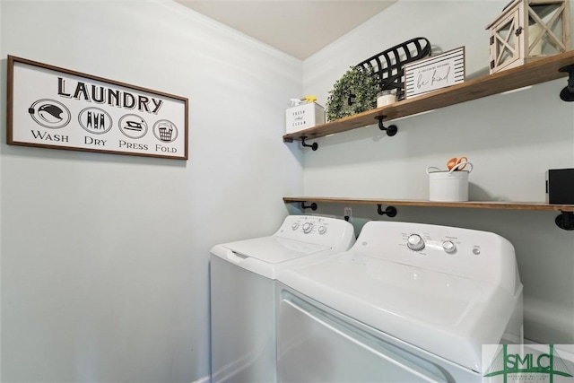 laundry room featuring washing machine and clothes dryer