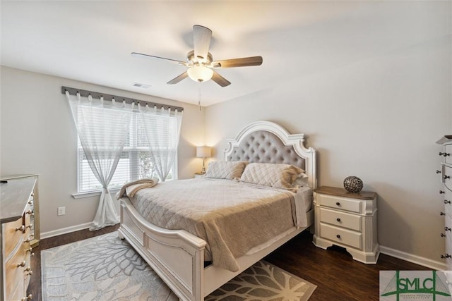 bedroom with ceiling fan and dark hardwood / wood-style floors