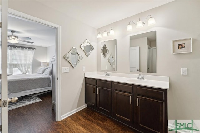 bathroom with ceiling fan, hardwood / wood-style floors, and vanity