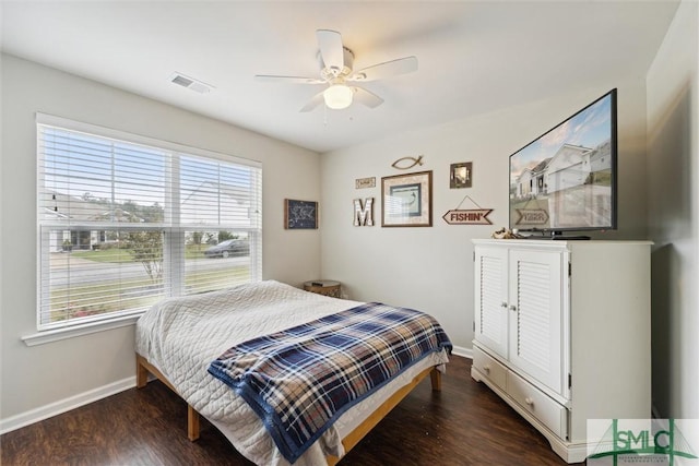 bedroom with dark wood-type flooring and ceiling fan