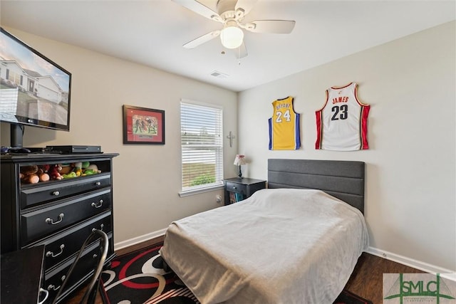 bedroom featuring dark wood-type flooring and ceiling fan