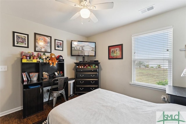 bedroom with ceiling fan and dark hardwood / wood-style flooring