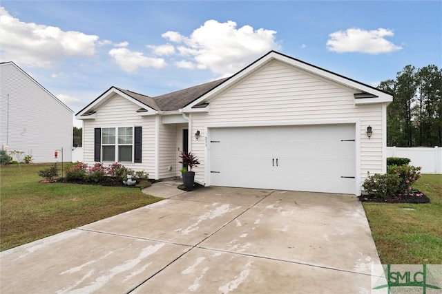 ranch-style house featuring a garage and a front lawn