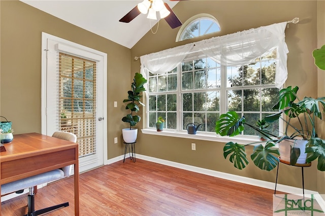 office space featuring hardwood / wood-style floors, vaulted ceiling, and ceiling fan