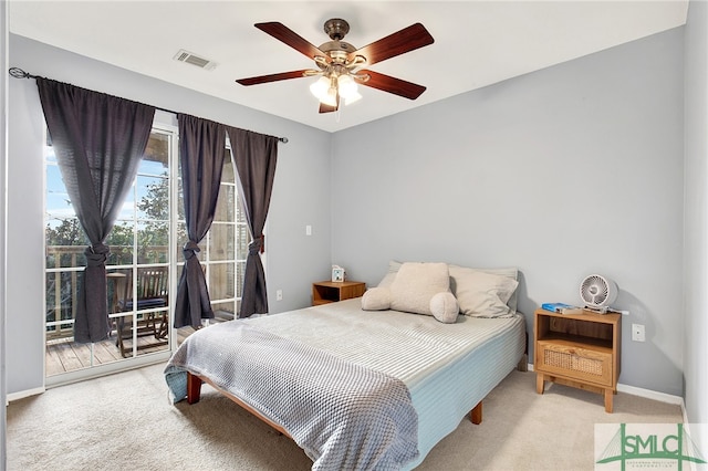 bedroom with access to exterior, ceiling fan, and carpet floors