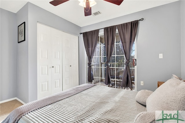 bedroom featuring carpet, ceiling fan, and a closet