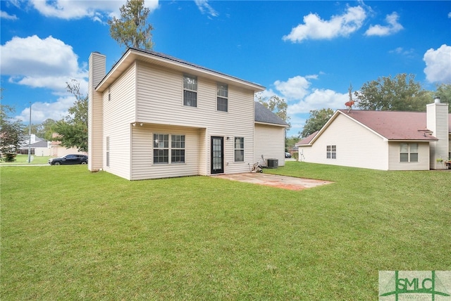 rear view of house with central air condition unit, a patio area, and a lawn