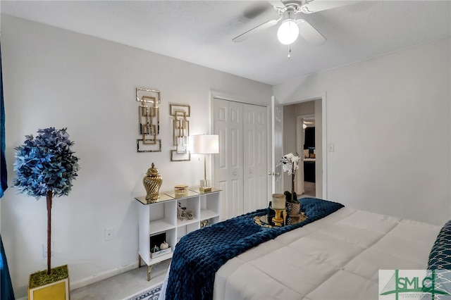 carpeted bedroom with a closet and ceiling fan