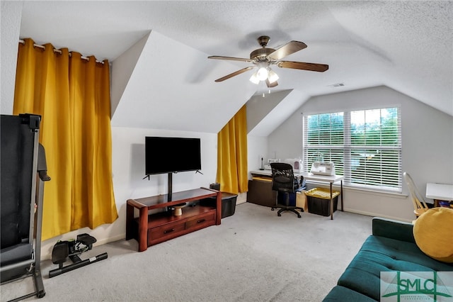 office area with a textured ceiling, light colored carpet, lofted ceiling, and ceiling fan