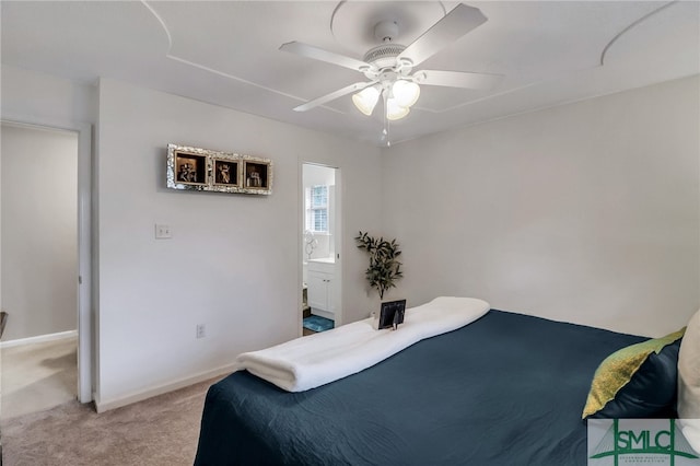 bedroom featuring ensuite bathroom, ceiling fan, and light colored carpet