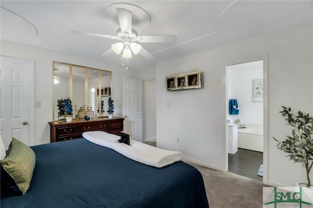 bedroom featuring a closet, light colored carpet, ceiling fan, and ensuite bathroom