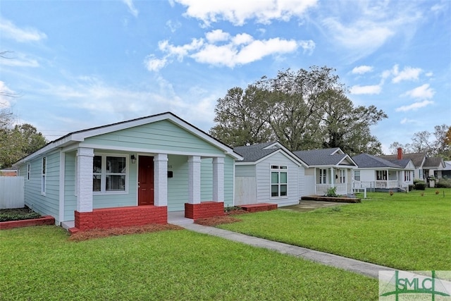 view of front facade featuring a front yard and a porch