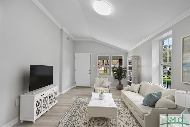 living room with light wood-type flooring, crown molding, and vaulted ceiling