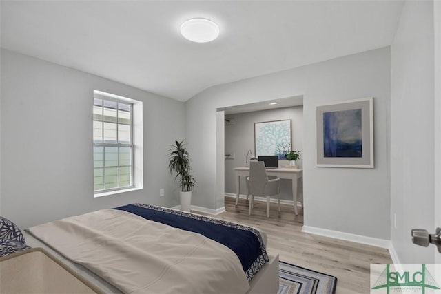 705 W 47th St, Savannah, GA 31405 - bedroom featuring wood finished floors, baseboards, vaulted ceiling, and a desk